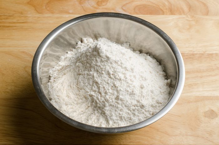 Flour bowl on wood surface