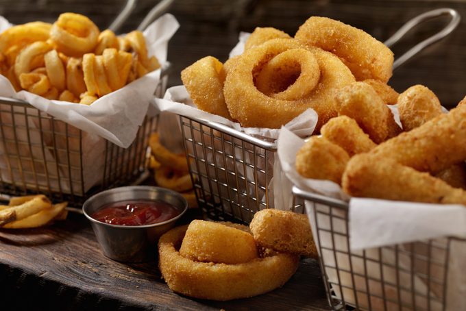 Baskets of Onion Rings, Curly Fries and Cheese Sticks