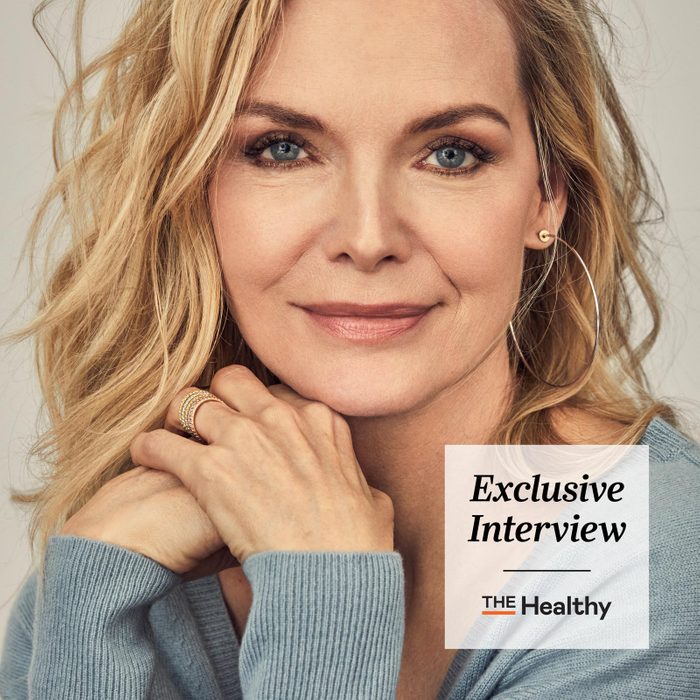Th Exclusive Interview close up portrait of Michelle Pfeiffer in a blue sweater