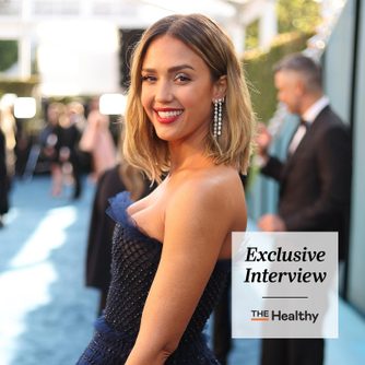 The Healthy Exclusive Interview Logo and a portrait of Jessica Alba