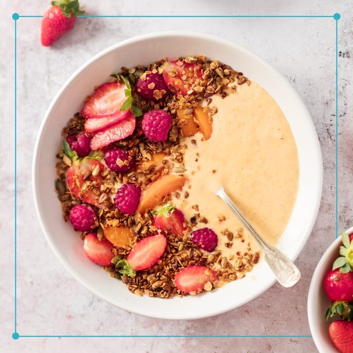 a healthy smoothie bowl with berries and granola