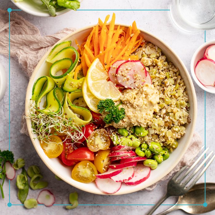 healthy bowl with grains and various vegetables