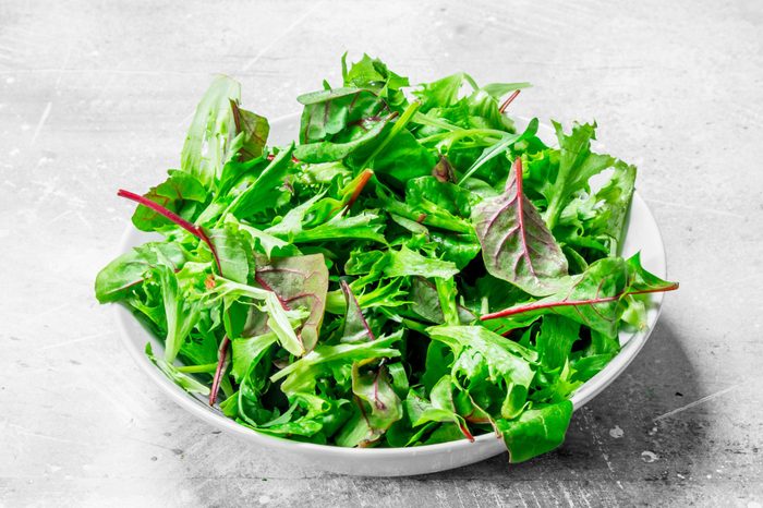 Healthy salad. Arugula salad in a bowl.
