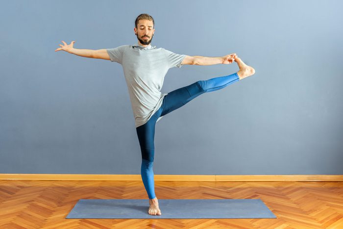 Man Utthita Hasta Padangustasana pose in yoga