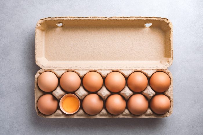Organic chicken eggs in a carton on a kitchen counter