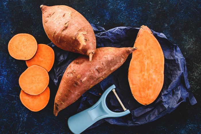 Sliced and whole sweet potatoes