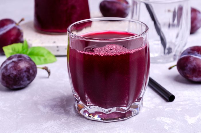 Red prune juice in glass