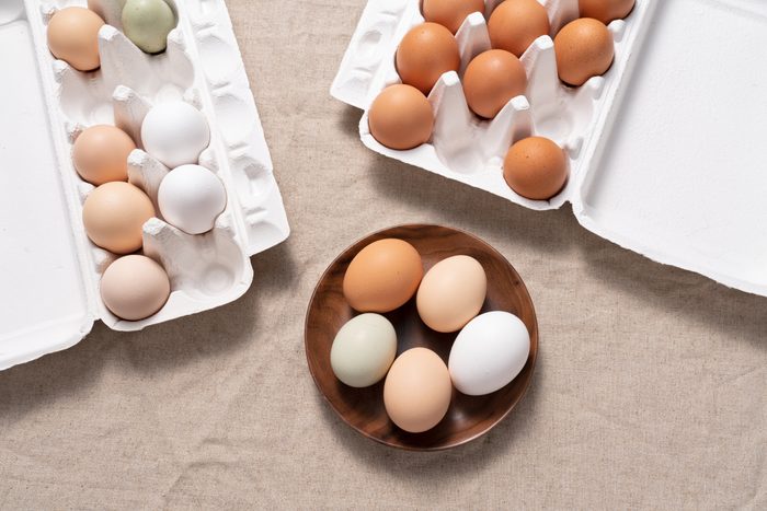 Multi Colored Chicken Eggs In Carton and Bowl