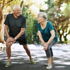 Shot of a senior couple warming up before a run outside