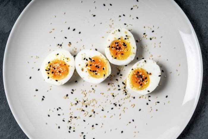 Halved hard-boiled eggs on a plate