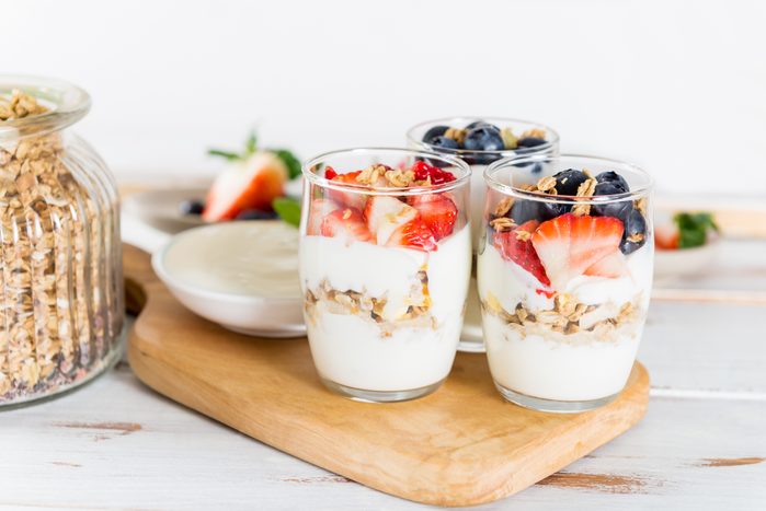 Little Jars with layered dessert from natural yogurt, granola an