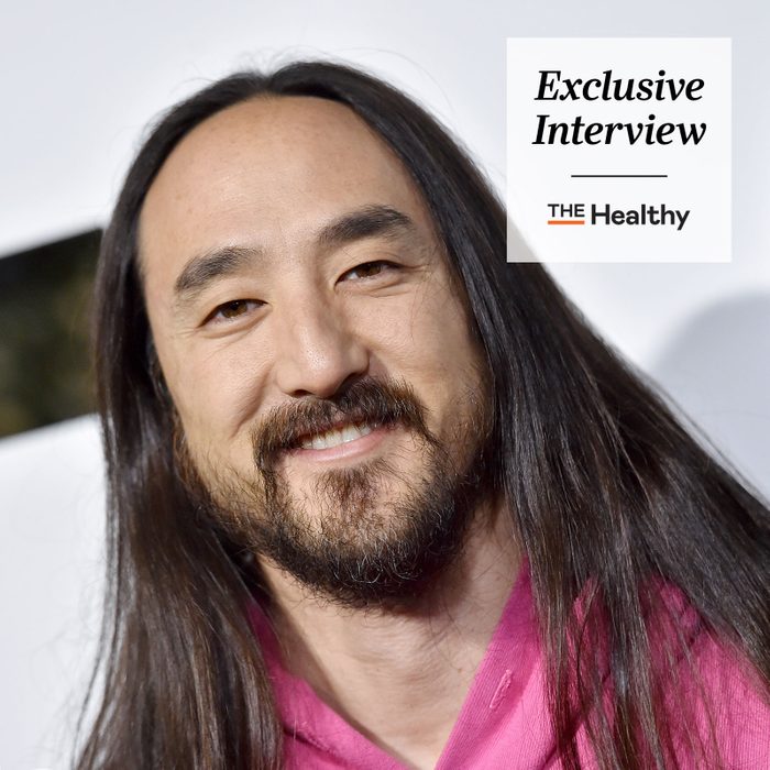 Steve Aoki headshot with The Healthy Exclusive Interview logo in upper right corner