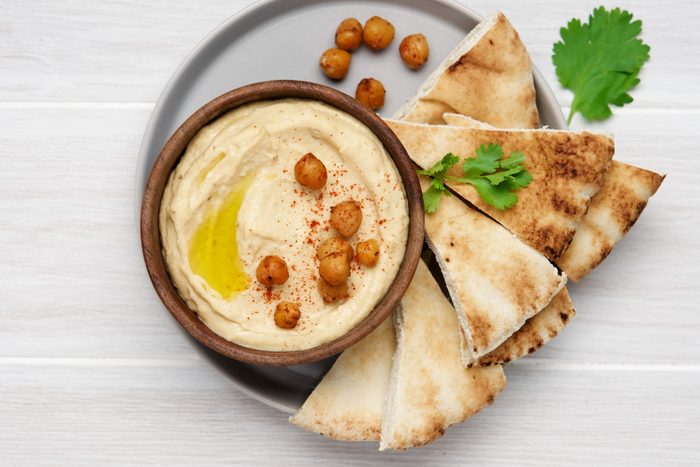 Hummus plate with pita bread. Authentic arab cuisine
