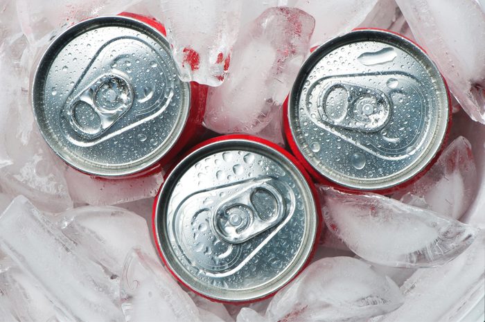 top view of soda cans in ice