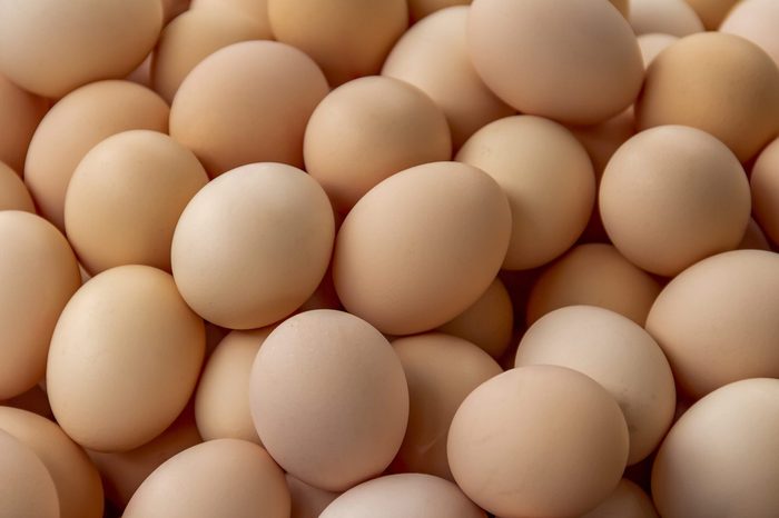 full frame background showing lots of brown eggs