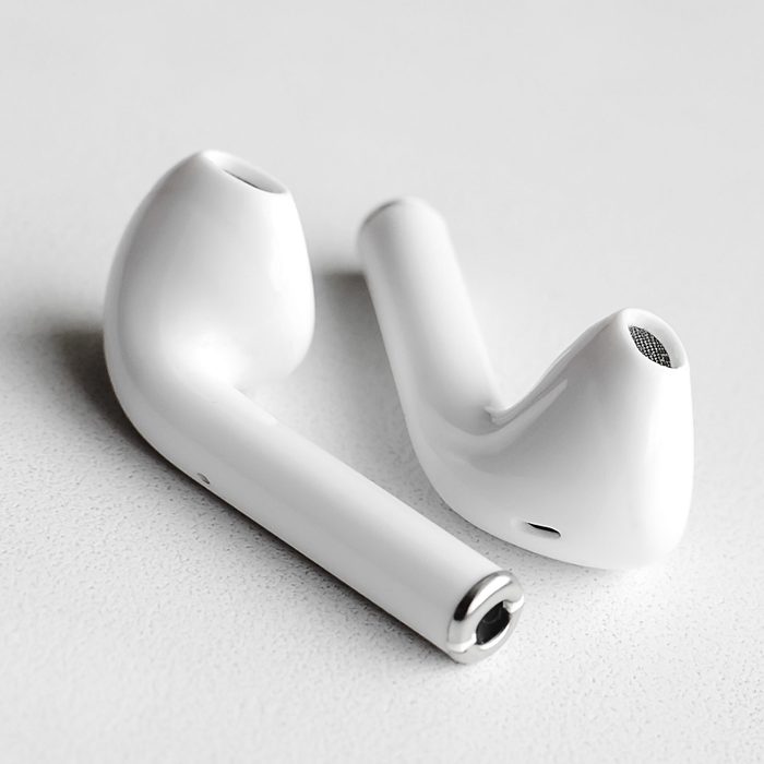 Wireless headphones on a white background, Close-up. The concept of modern technology.