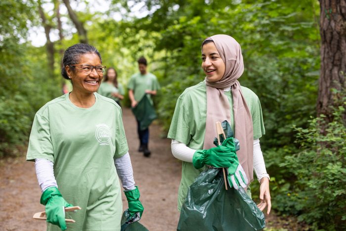 Women working as volunteers in saving the environment from garbage