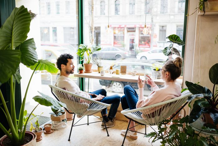 Couple Hanging Out in Café With Lots Of Plants
