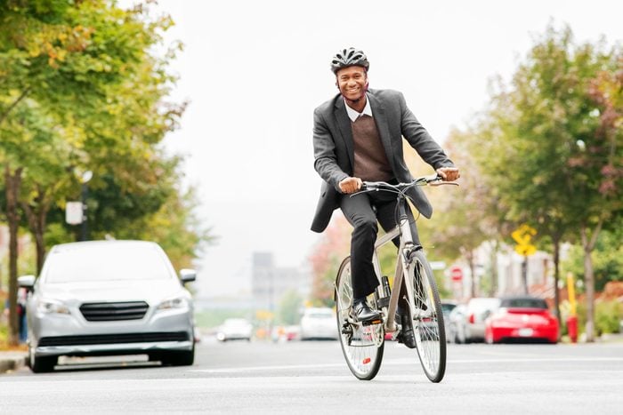 happy man riding his bike to work