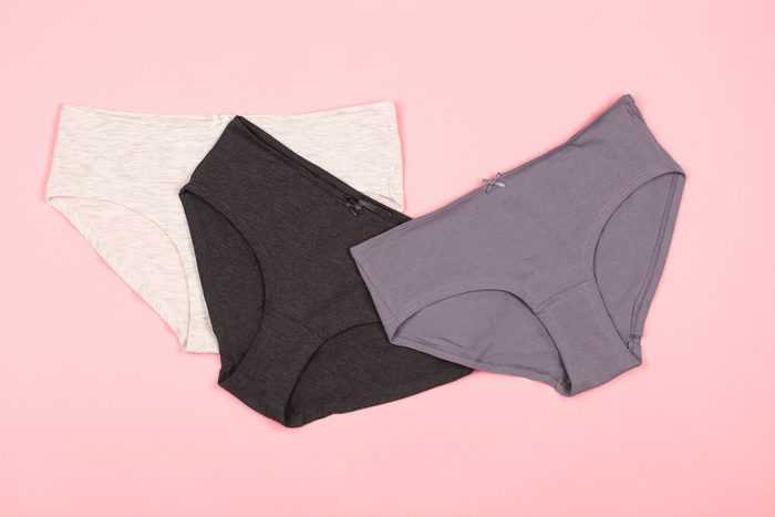 Woman panties on the pastel pink background.