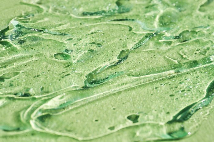 Abstract Background with Aloe Vera Moisturizing Cleaning Cosmetic Gel or Face serum, essential oil with Oxygen Aqua Bubbles on pastel green mint color.
