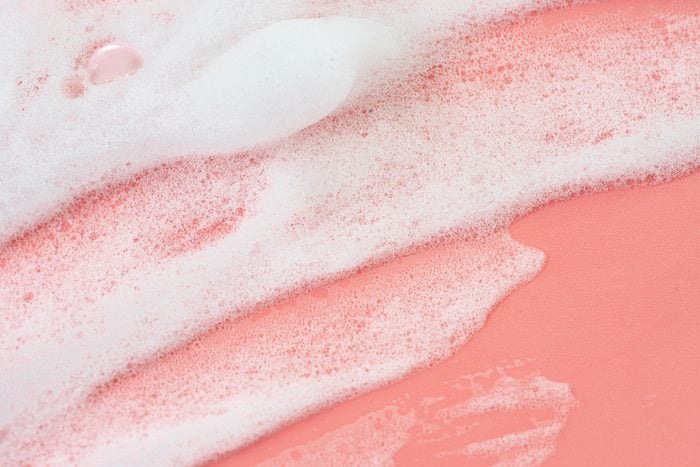 soap suds on a pink background