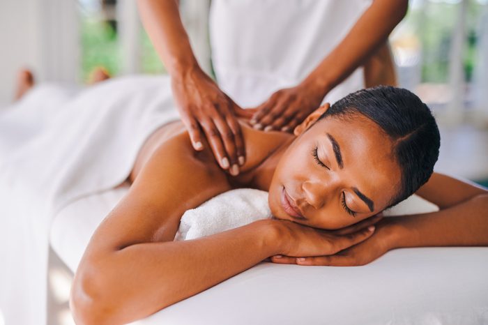 woman sleeping while getting a massage