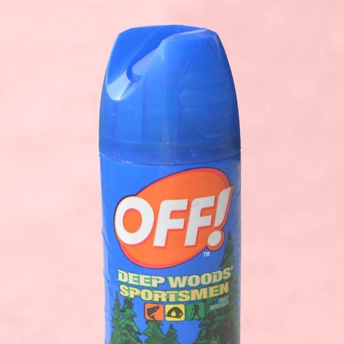 off insect repellant on a pink background
