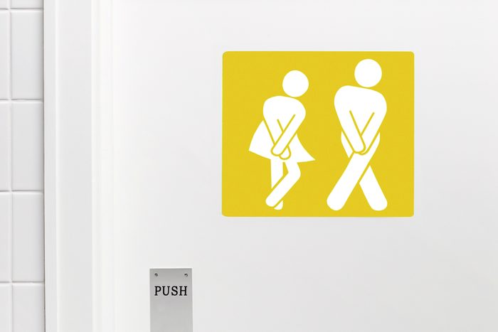 Uti Bathroom Sign With Two Figures With Crossed Legs