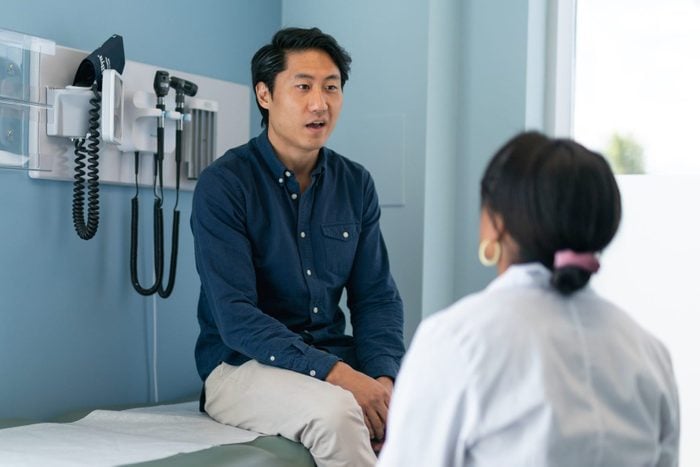 Korean man in consultation with doctor