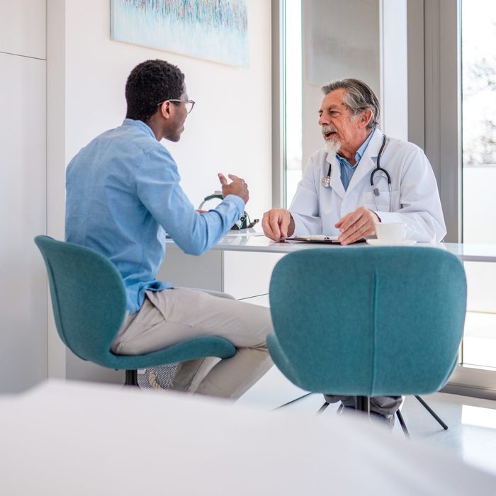 Mid Adult Black Male Patient Visiting A Doctor At A Healthcare Facility