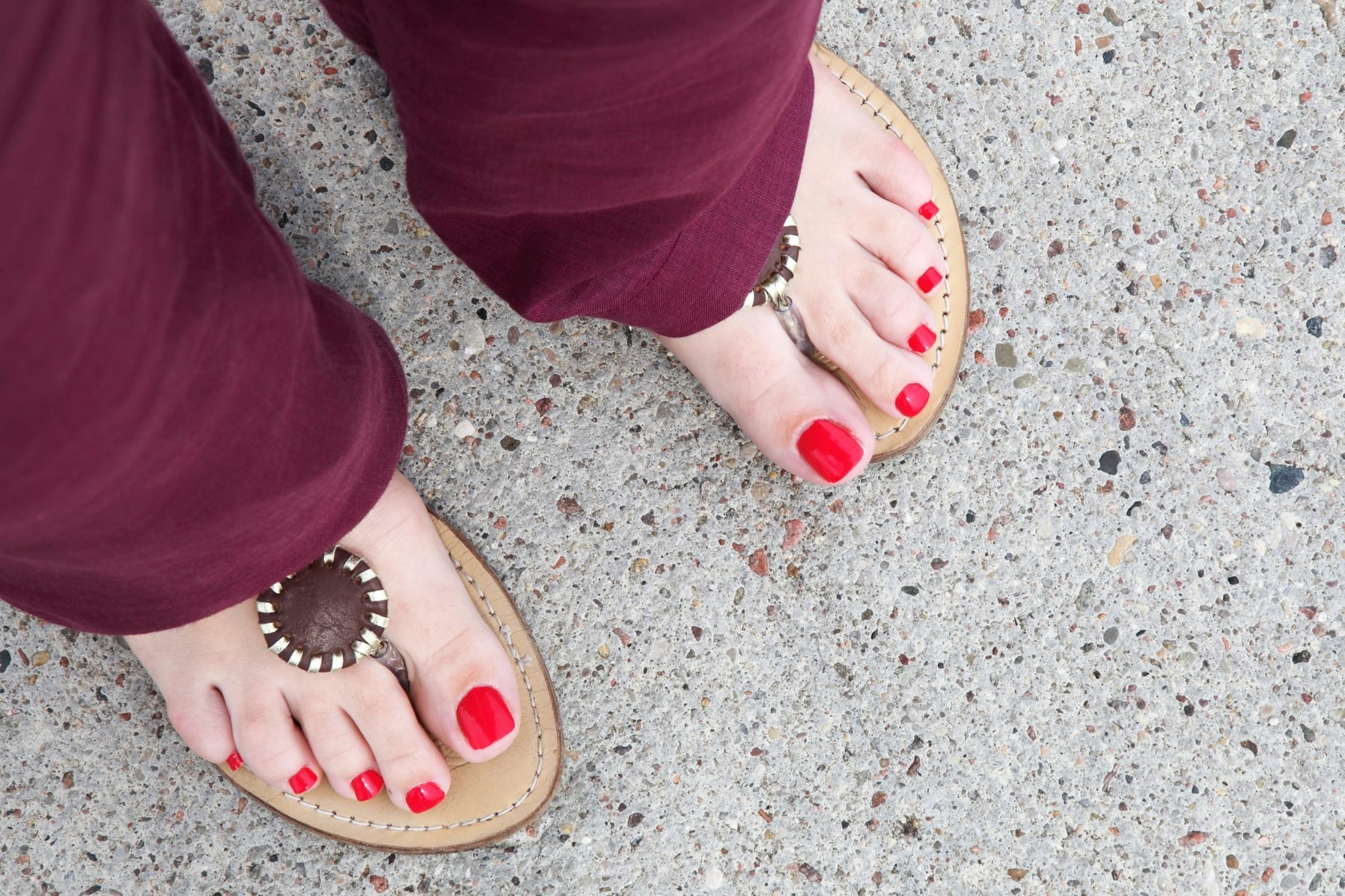 feet of a caucasian woman flip-flops