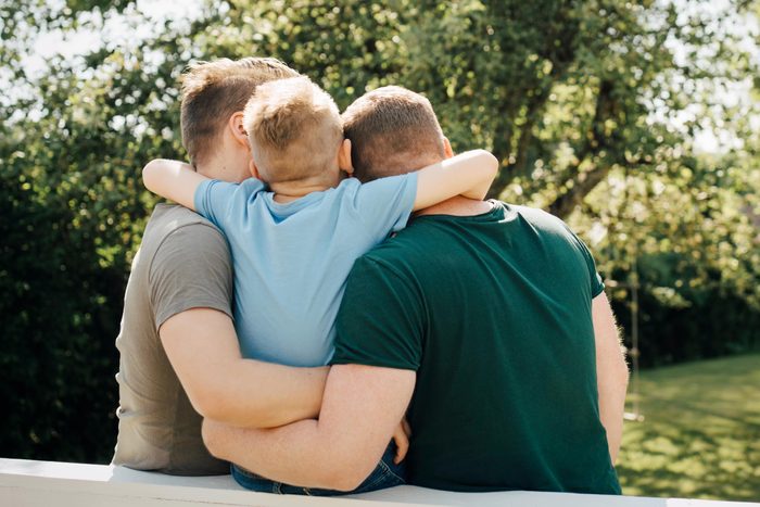 two others and a son hugging