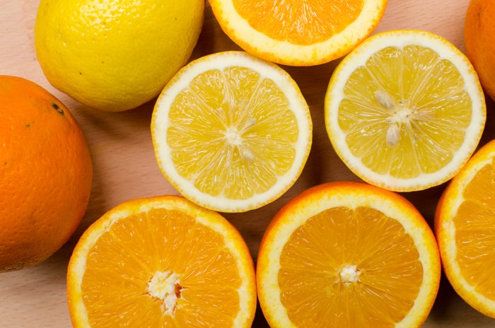 Sliced in half oranges and lemons