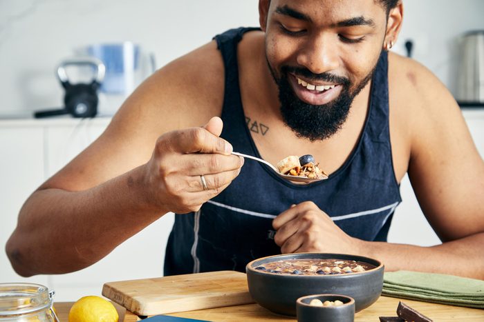 Fit & healthy man enjoying healthy breakfast one bite at a time