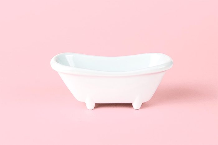 toy bathtub on pink background