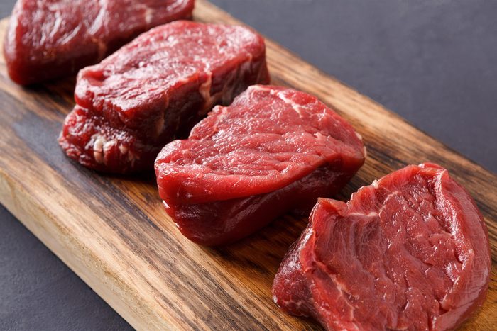 Lean steaks on a cutting board