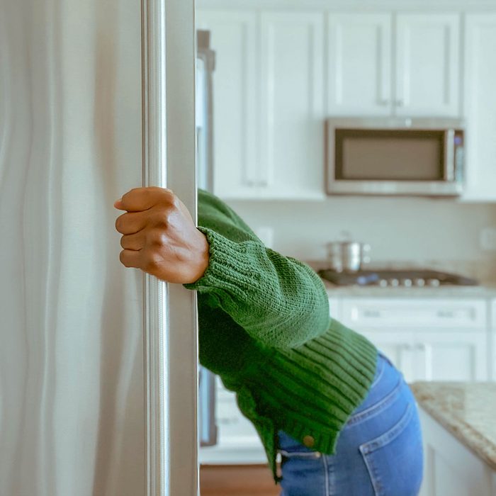Lady looking into fridge