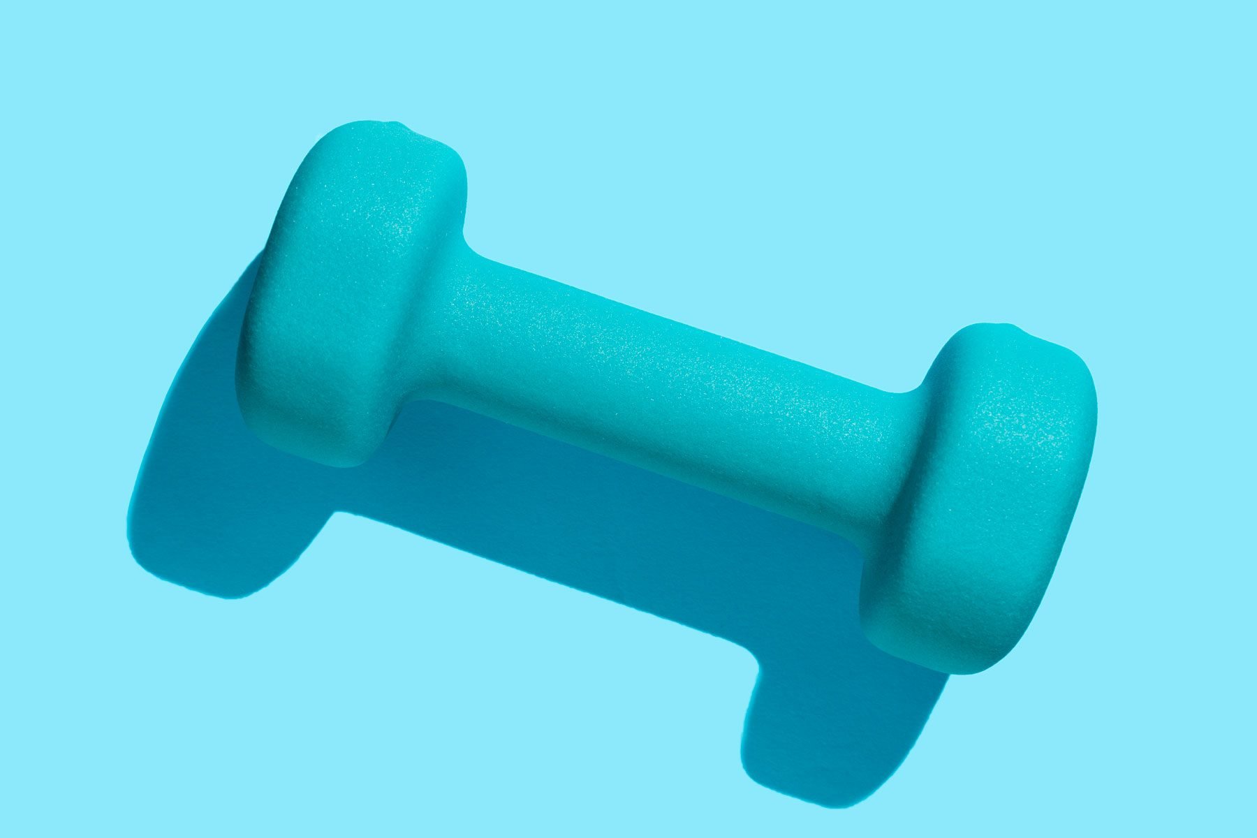 blue Dumbbell hand weight on blue background|