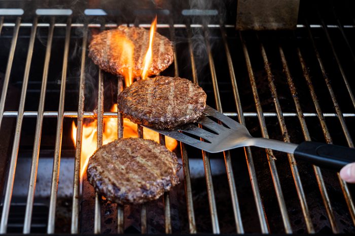 Burgers cooking onbarbecue grill