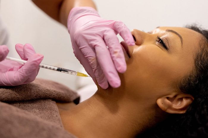 Beautiful woman getting fat burning injections in her chin