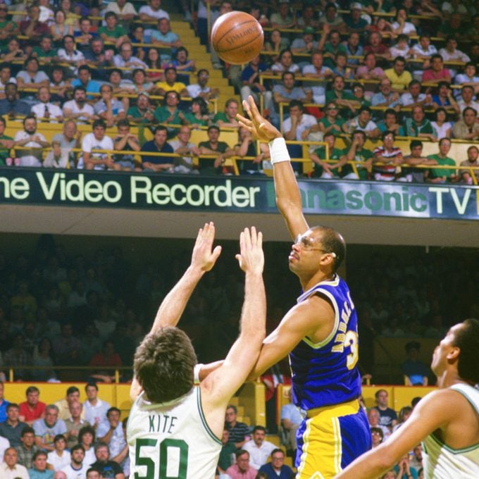Kareem Abdul-Jabbar #33 of the Los Angeles Lakers shoots over Greg Kite #50 of the Boston Celtics during the 1987 NBA Basketball Finals at the Boston Garden
