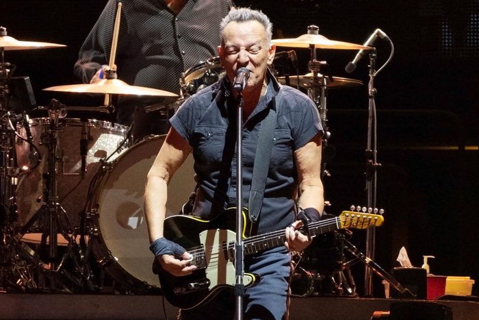 Bruce Springsteen on stage with guitar singing