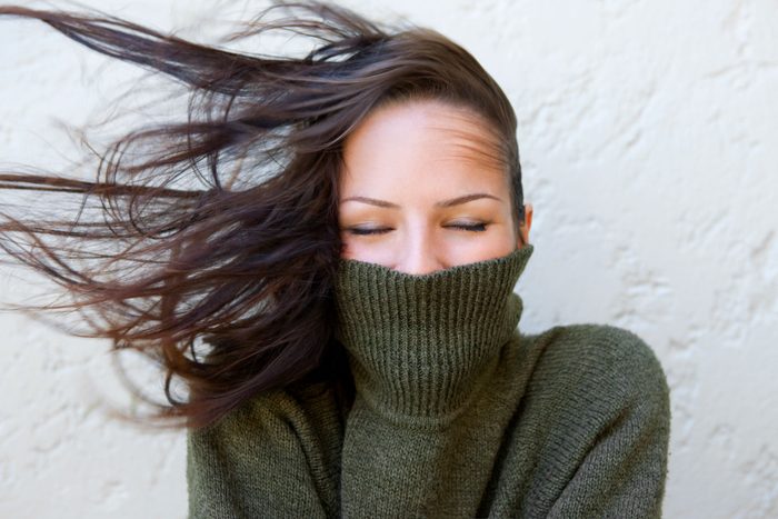 woman with a turtle neck hiding her double chin