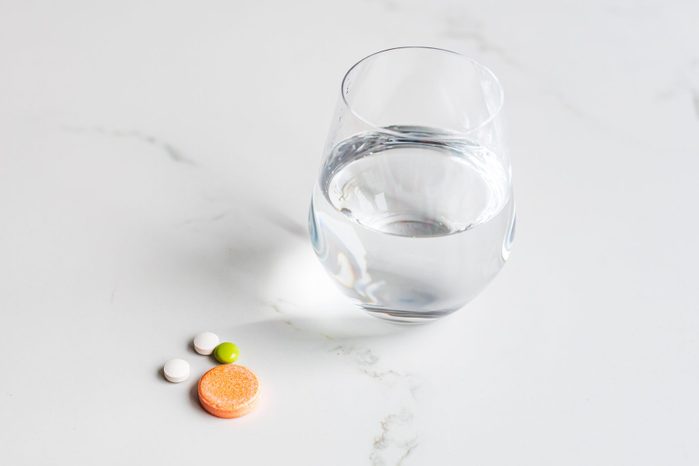 Multivitamins with water glass