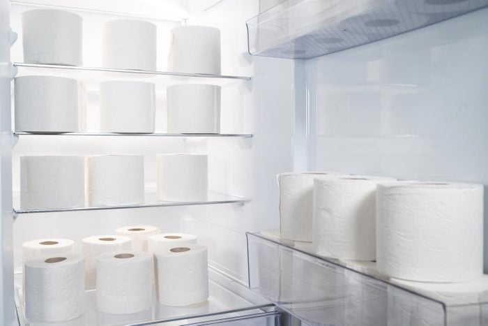 Open Refrigerator With Large Amount Of Toilet Paper Rolls Inside Humorous Storage Concept