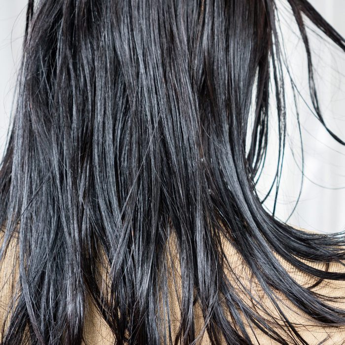 woman have problems with oily hair and thinning hair