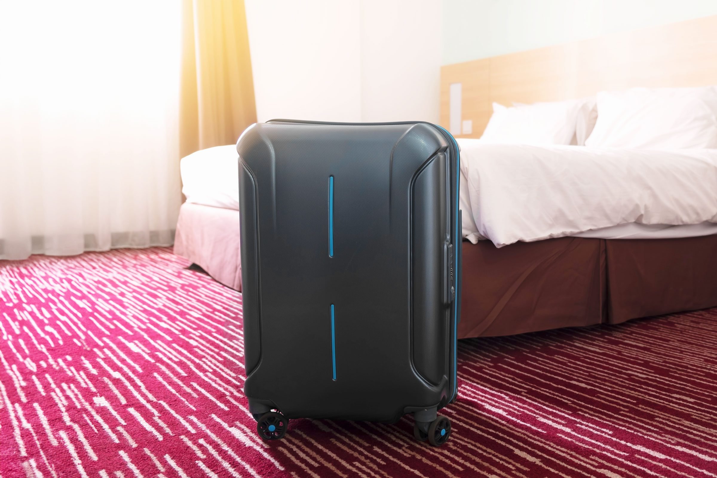 suitcase in a hotel room