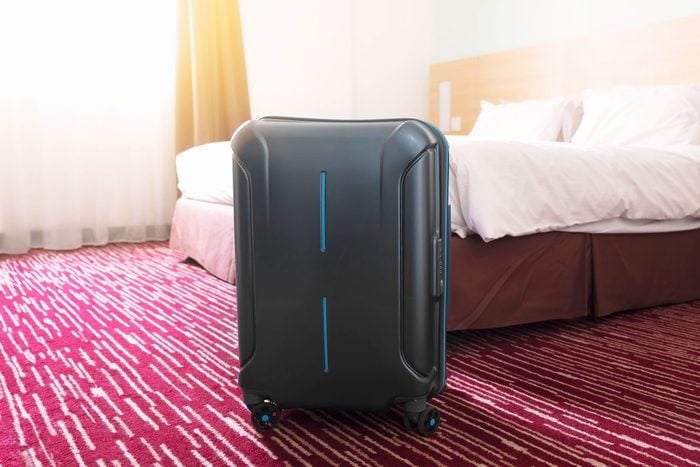 suitcase in a hotel room