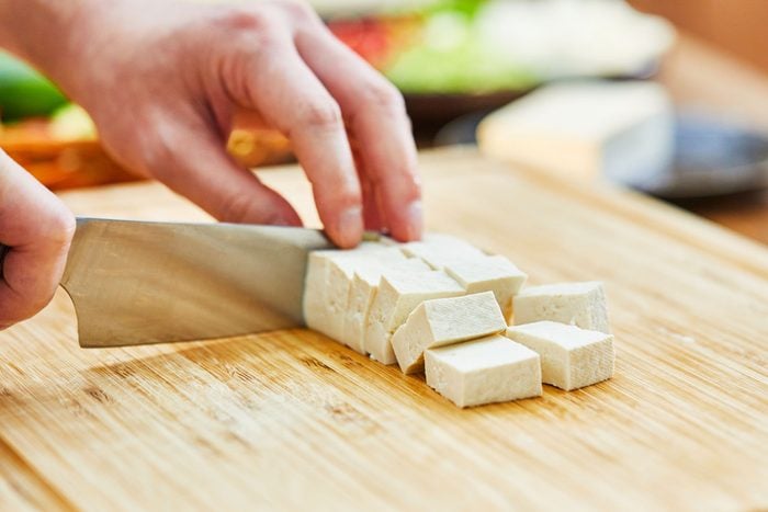 cutting tofu o na wooden cutting board